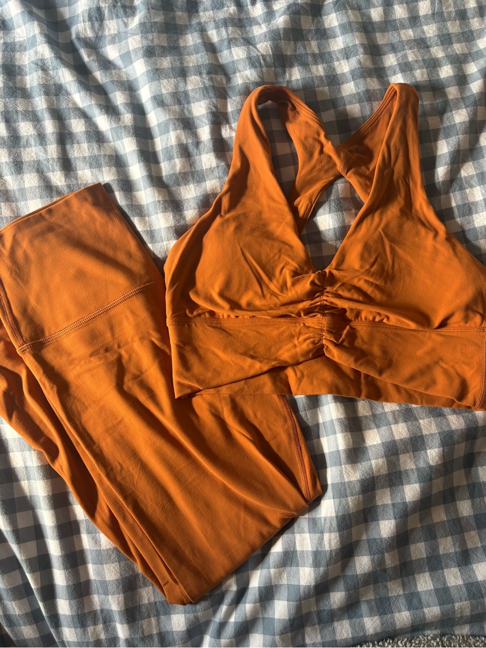 Aritzia TNA Action workout leggings and sport bra.